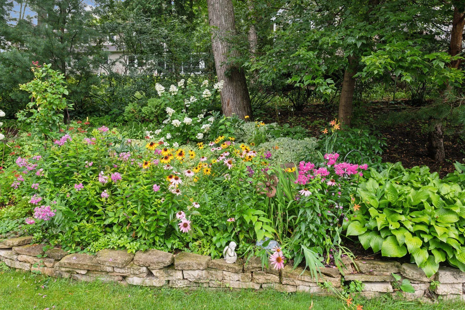 Perennials galore in the numerous gardens at 220 Glenbrook Rd. N.
