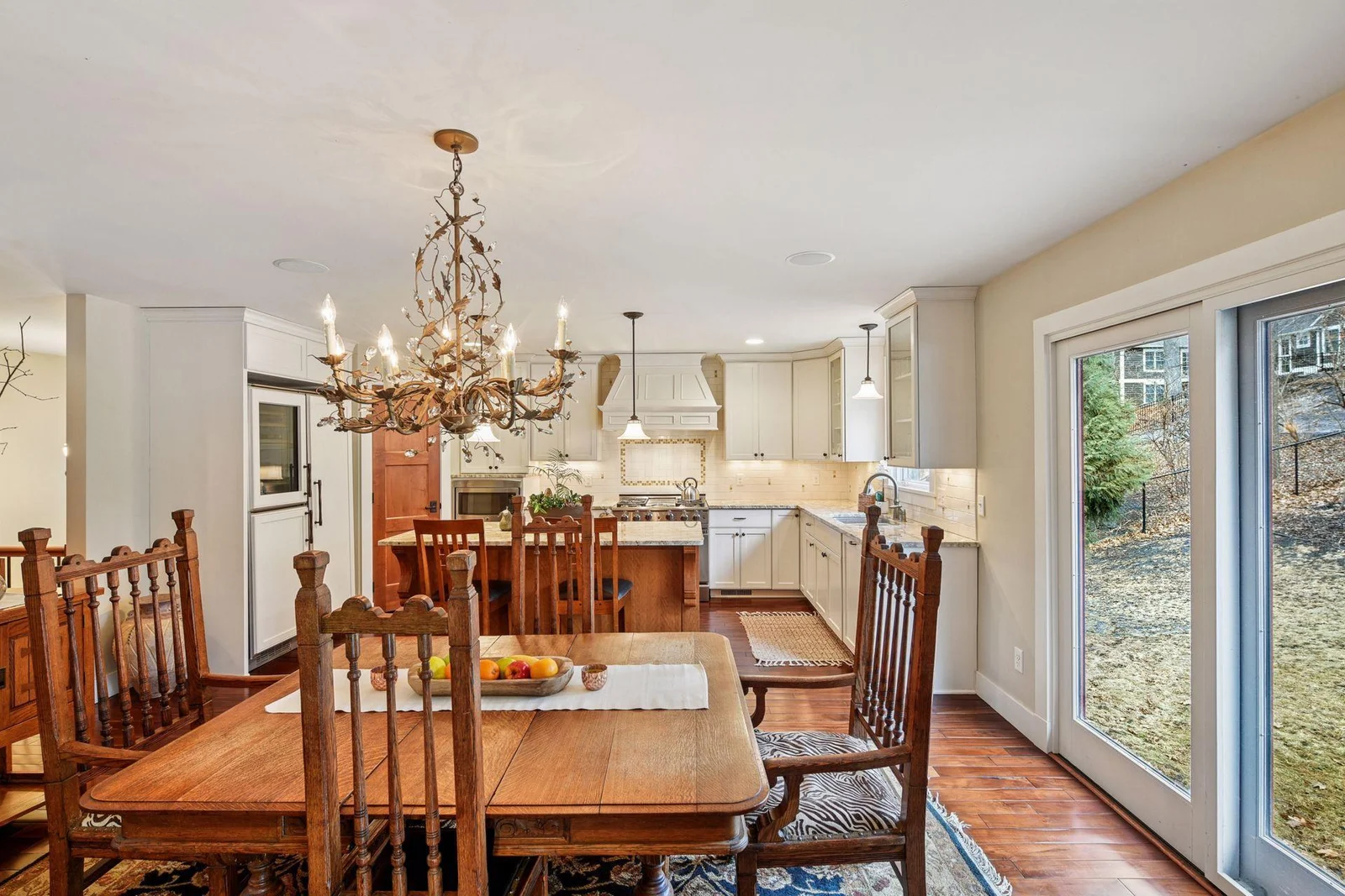 The informal dining area is flanked with another set of sliding glass doors to the backyard. Add another paver patio or deck here to expand your entertaining space or build a sun porch for year round enjoyment.