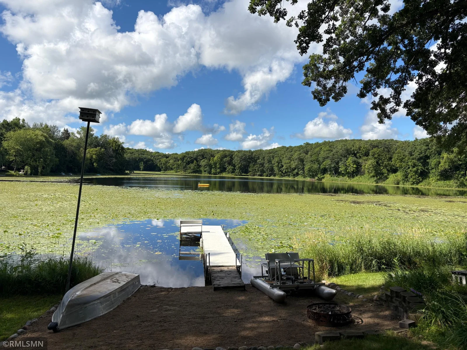 Here is lake beach area with a great view. The dock and boats are included in the sale. Great little lake for kayaking or canoeing.