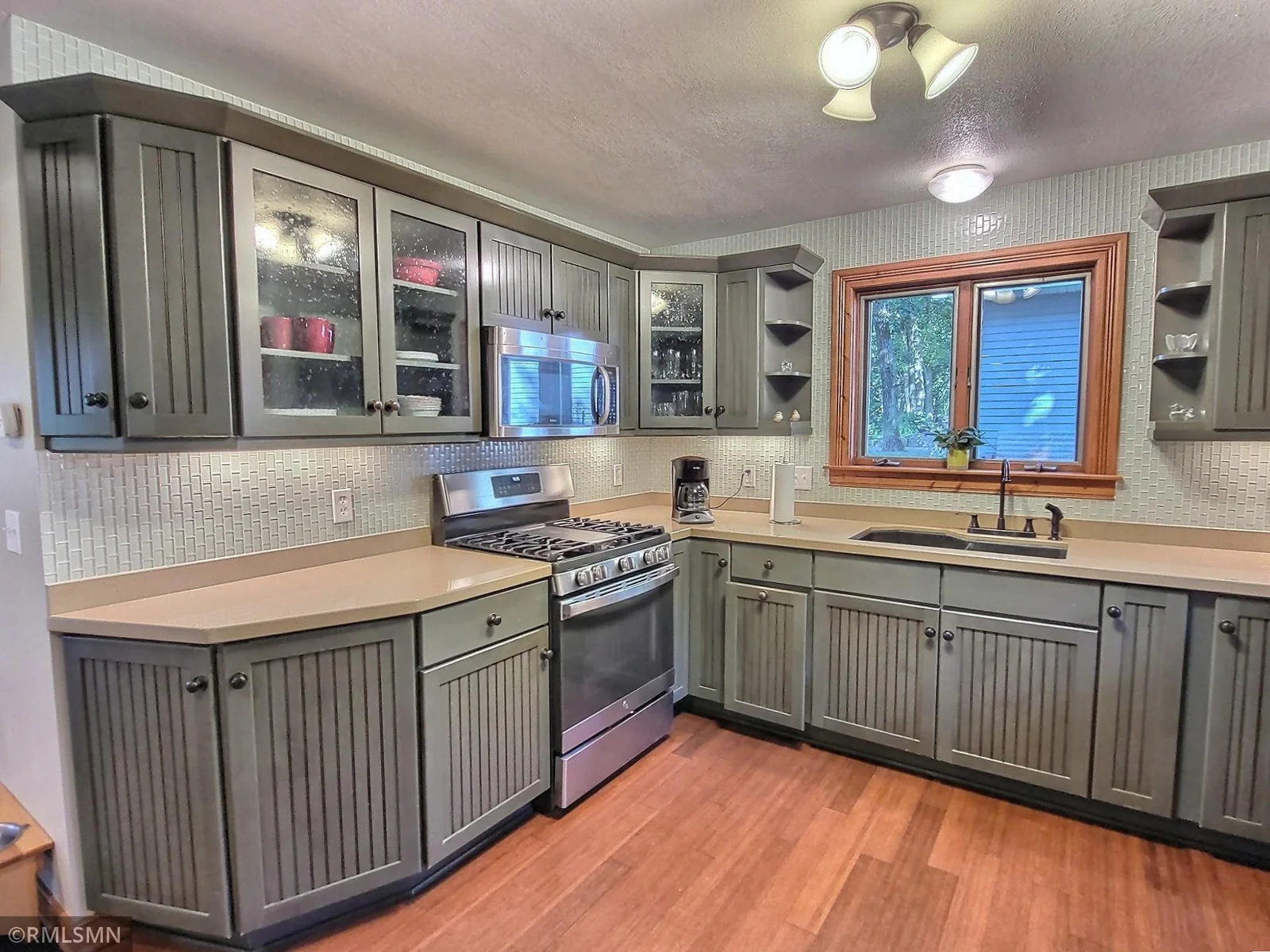 Enjoy a fresh, modern kitchen with ample cabinetry—an ideal space to prepare and enjoy your meals.