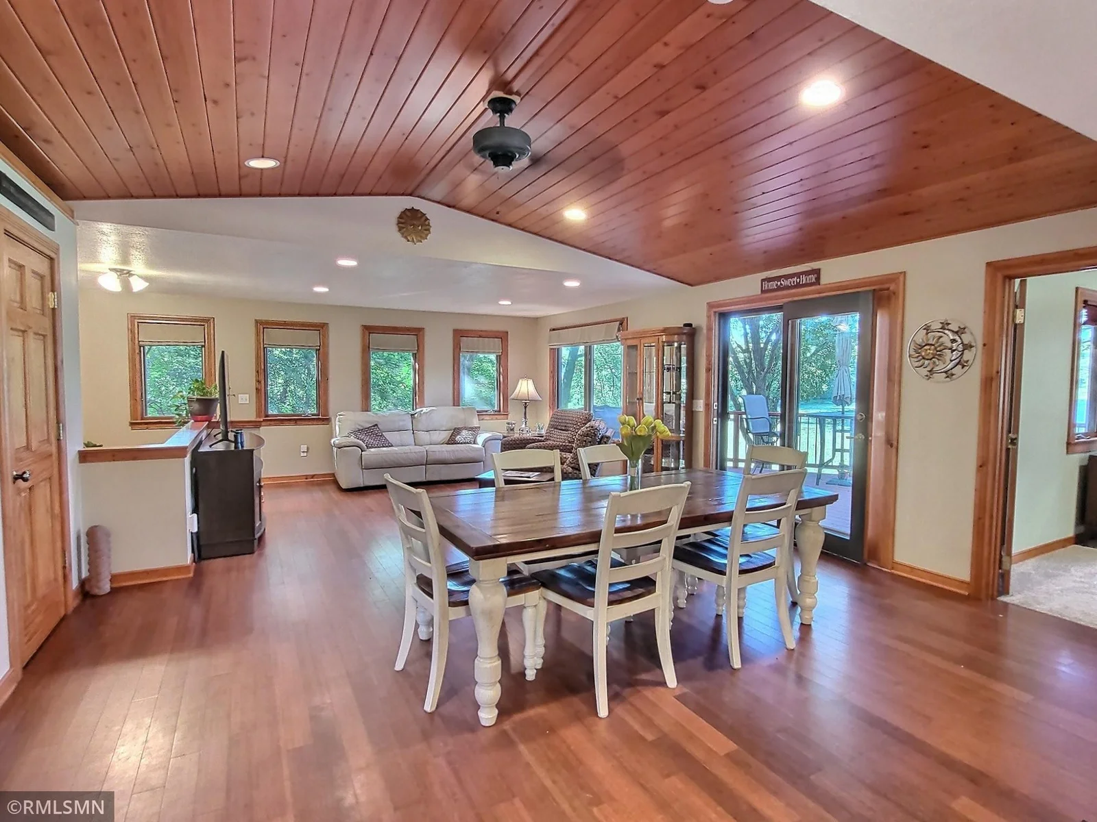 The upper level has an open layout and expansive windows bring in abundant natural light and offer stunning views of the surrounding landscape.