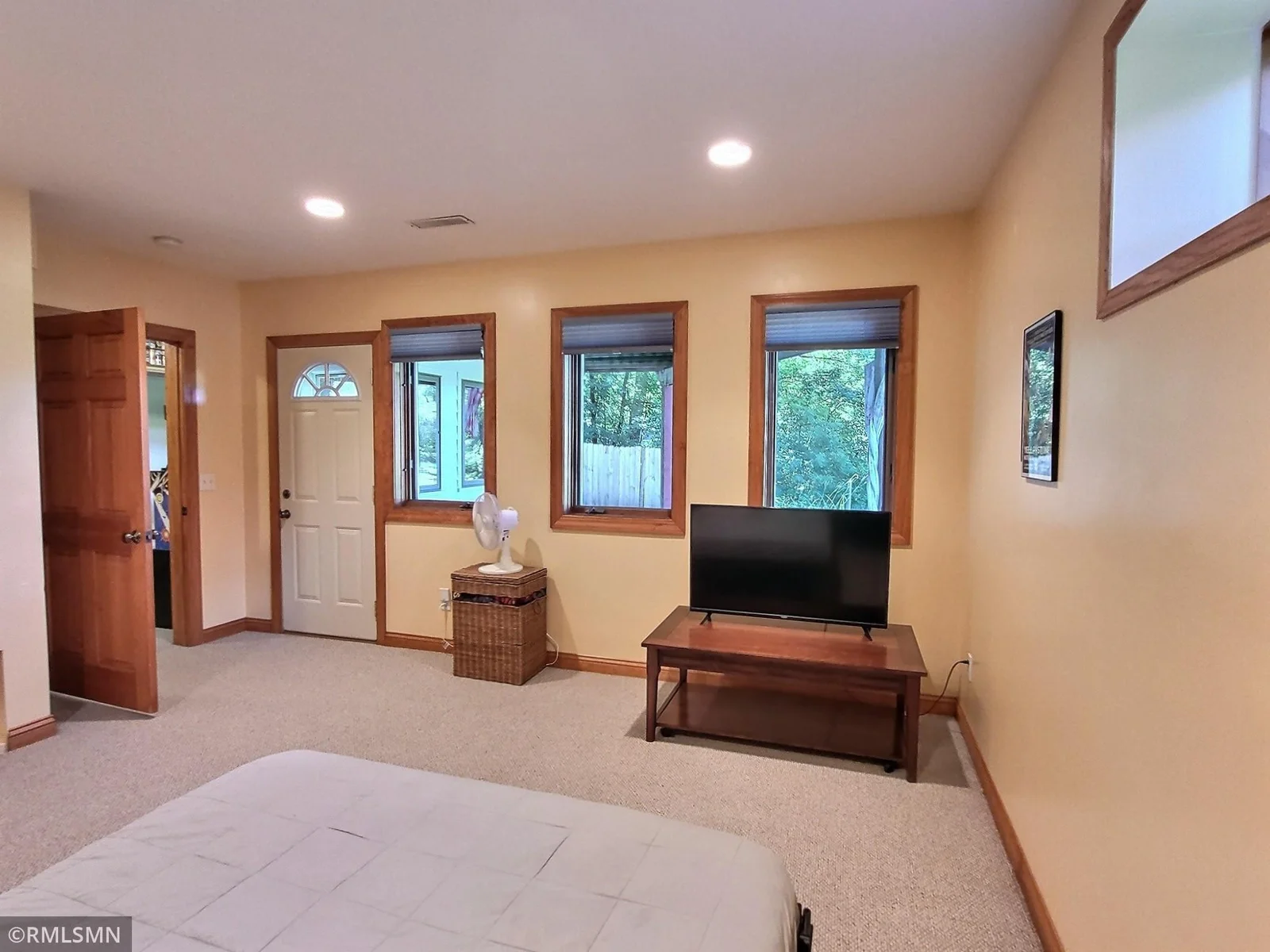 The 2nd shot of the lower level bedroom showing the direct access to the patio area.