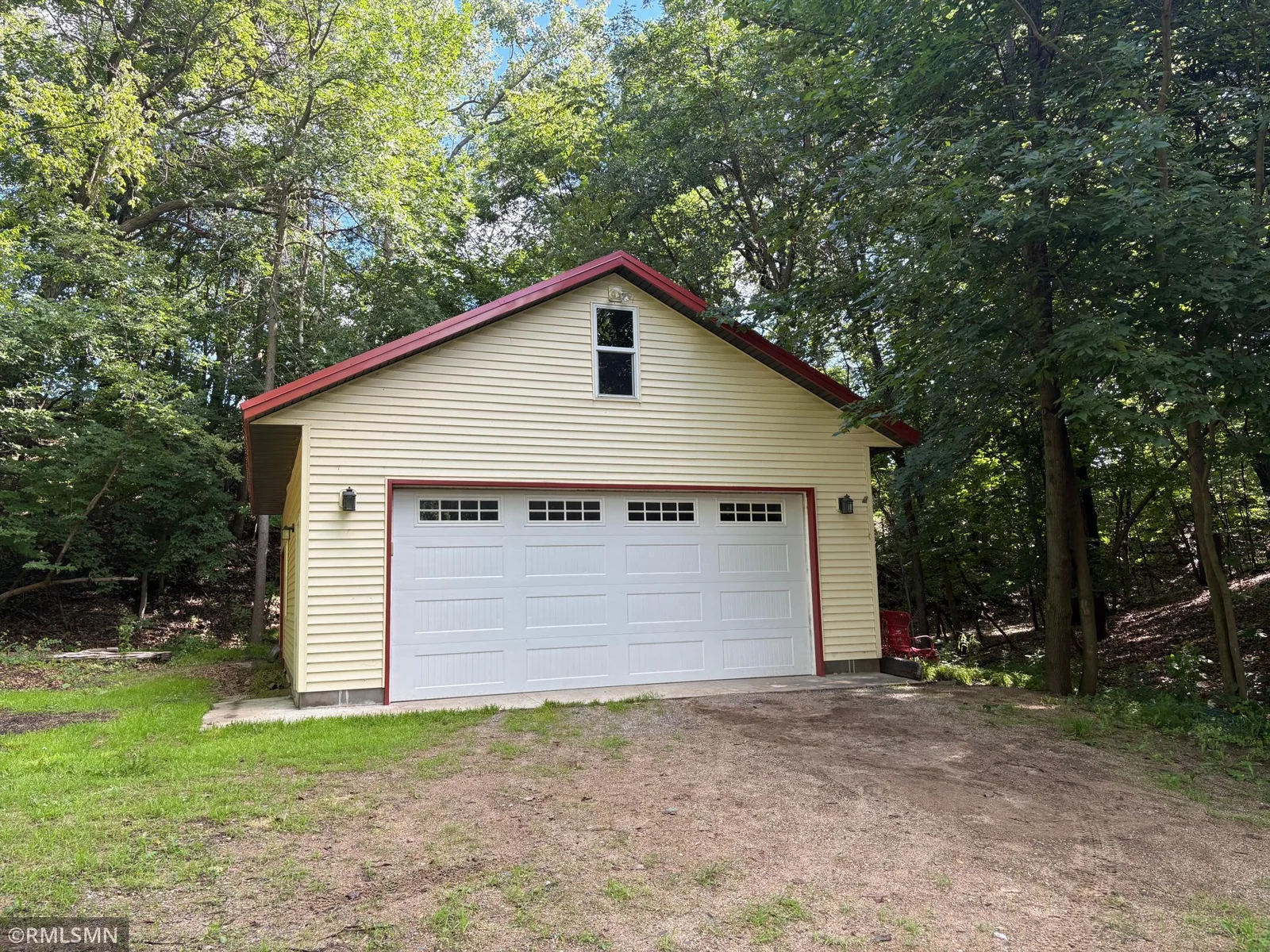 The back lot, just over 3 acres, features towering trees and offers exceptional privacy. Here you’ll find an oversized garage and garden shed.