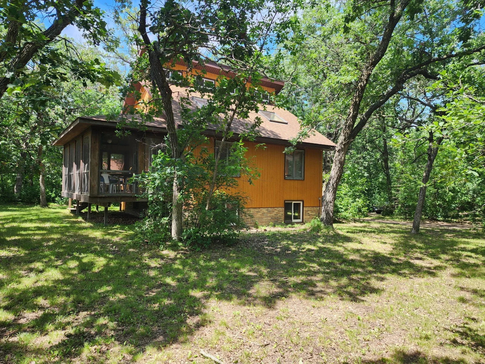 View of the house and screened in porch.jpg