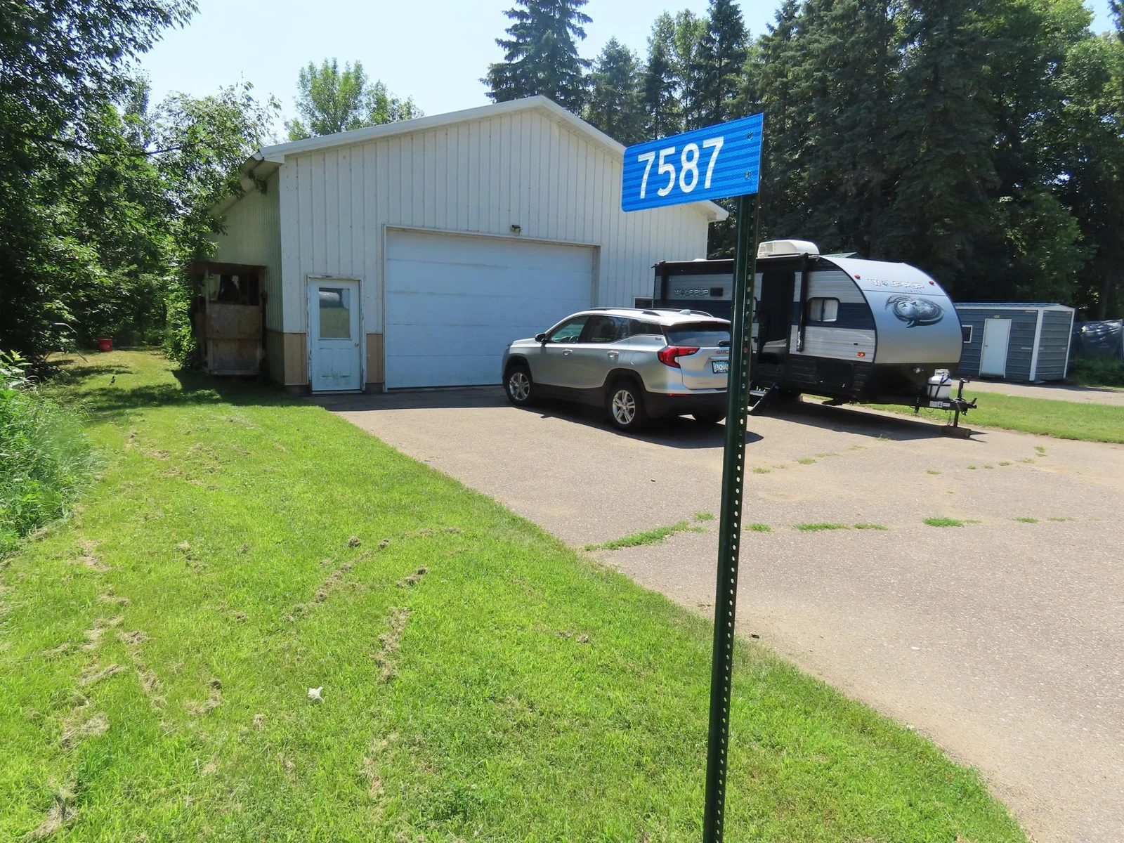Large garage with concrete drive