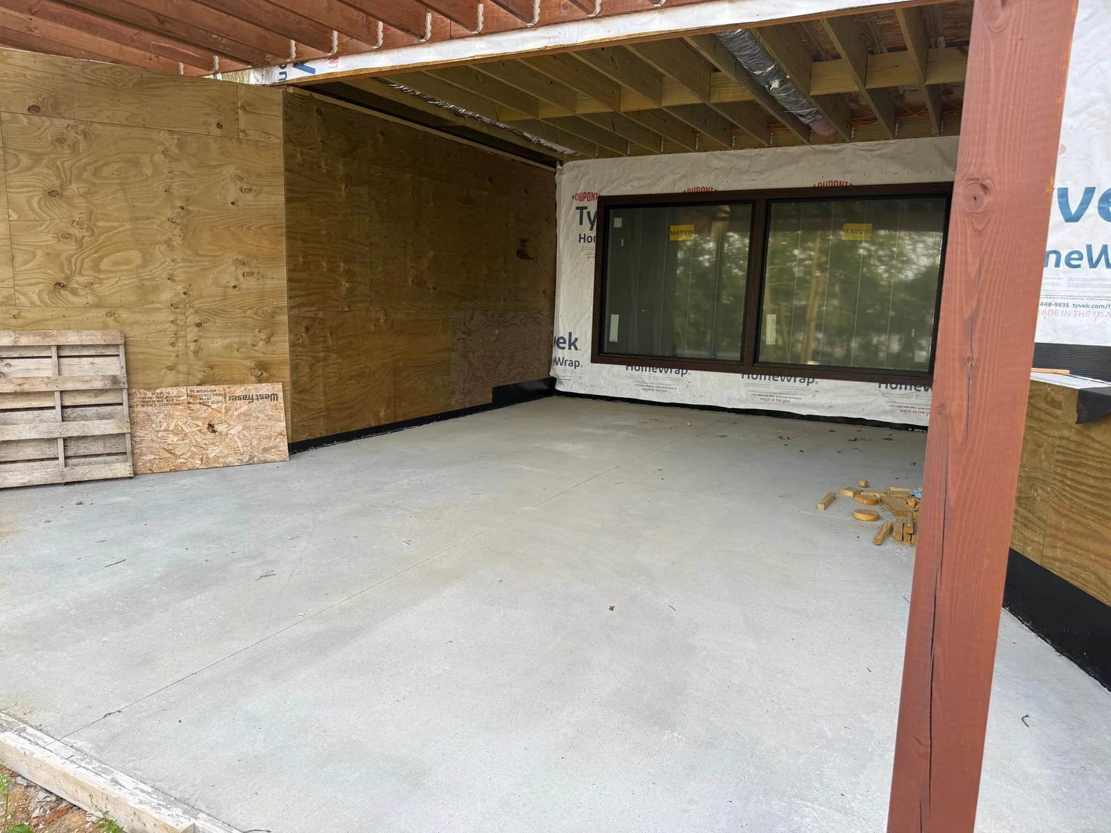 Concrete patio to lower level family room.