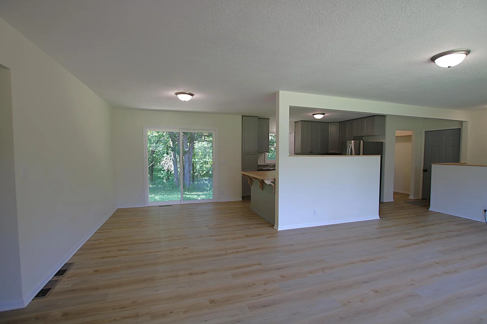 Dining area with breakfast bar and patio door