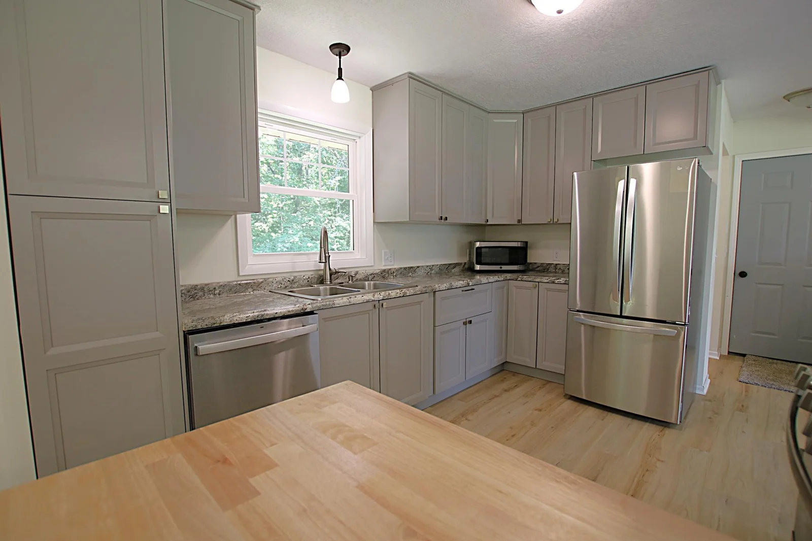 Stainless steel appliances in updated kitchen