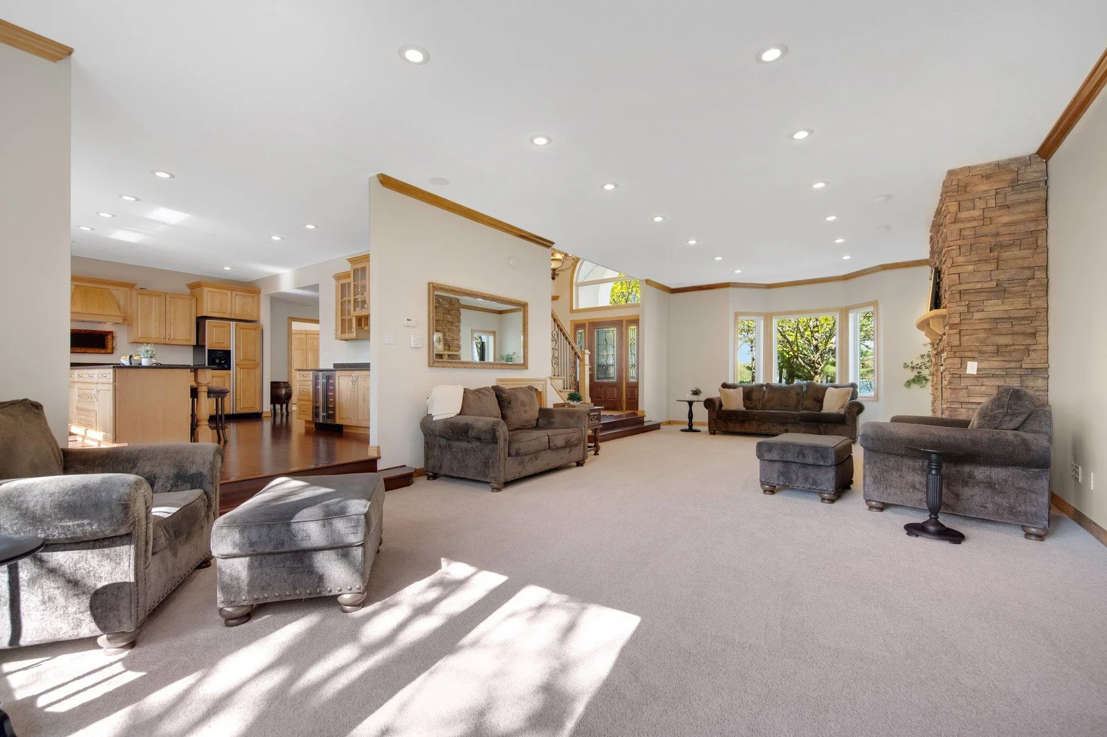 The gourmet kitchen flows beautifully into oversized sitting/living room.