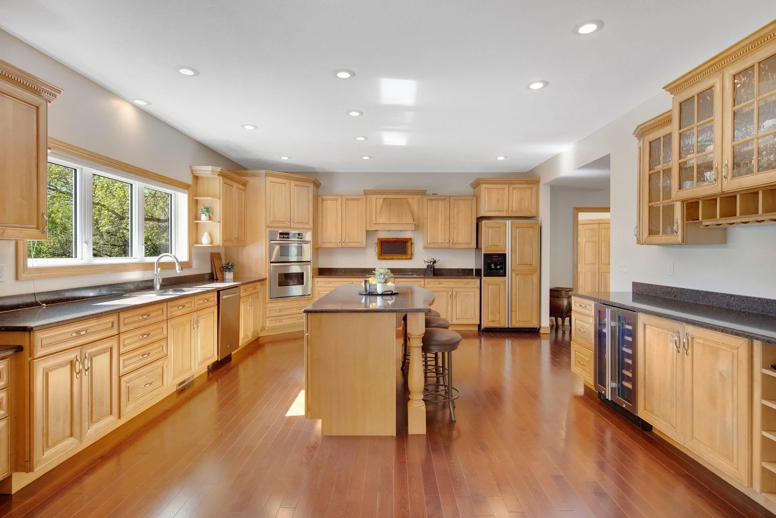 Step Inside to luxury and custom updates at its finest- Including this Gourmet Kitchen beautifully cared for.