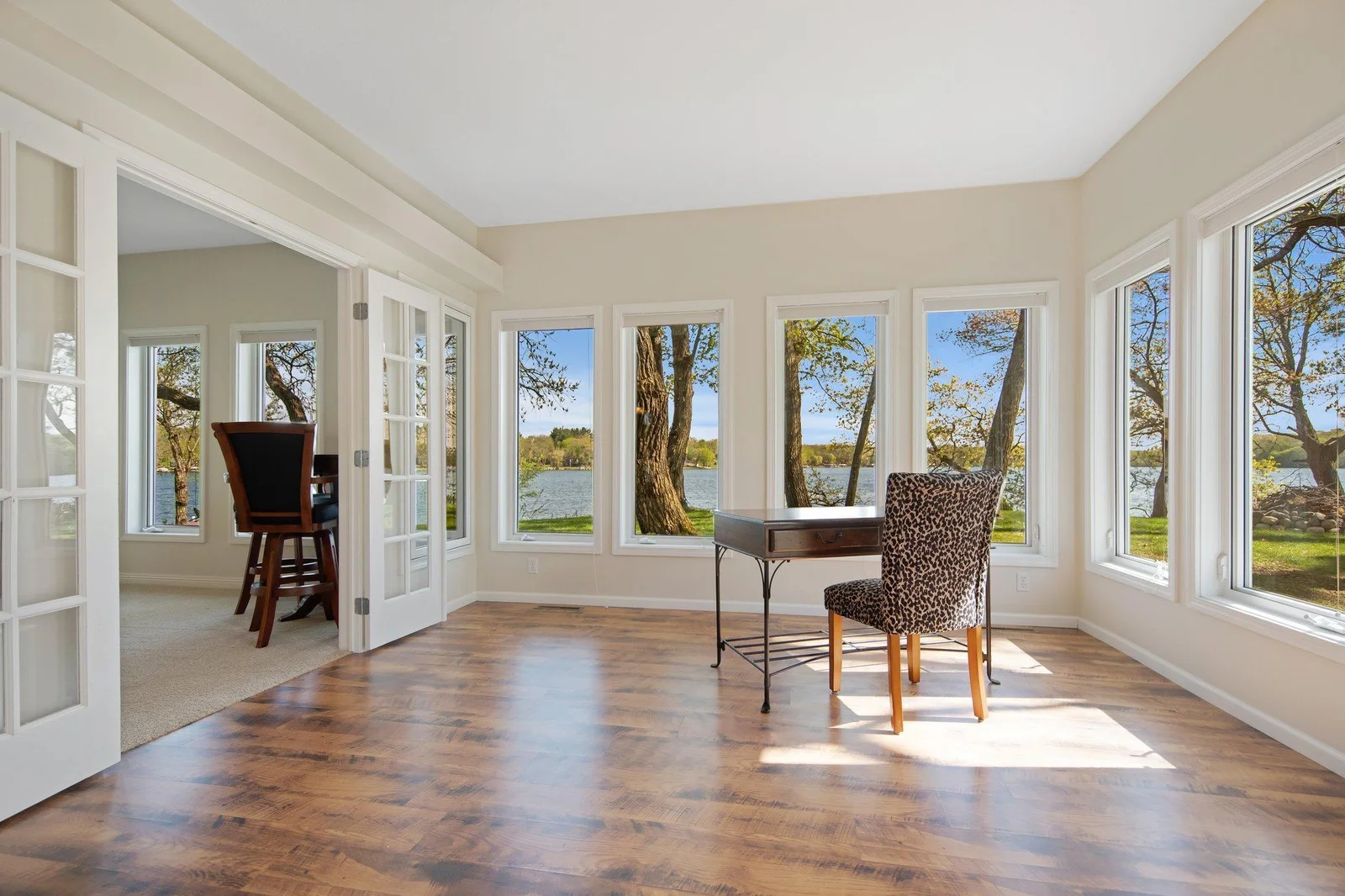 Flow on into this sun drenched room off the game room for additional entertaining space.  Or, could be converted into another main floor bedroom, office, etc.