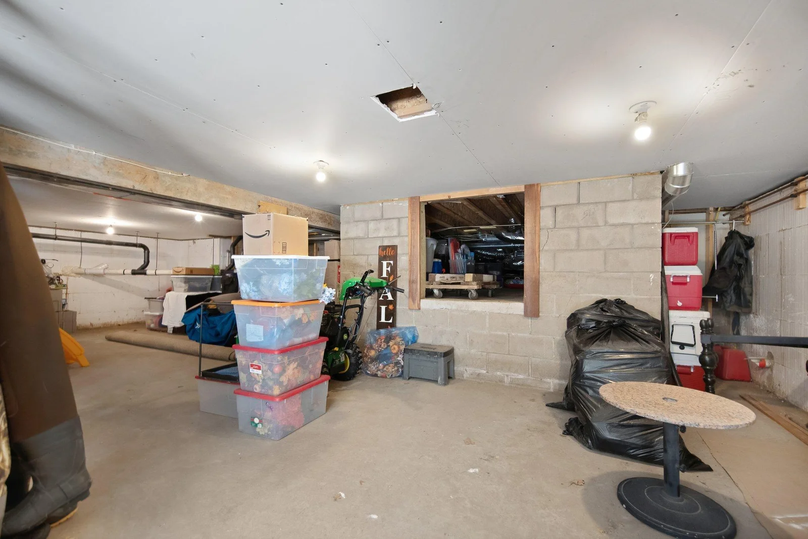 Even more storage under through the crawl space! This has lighting too!