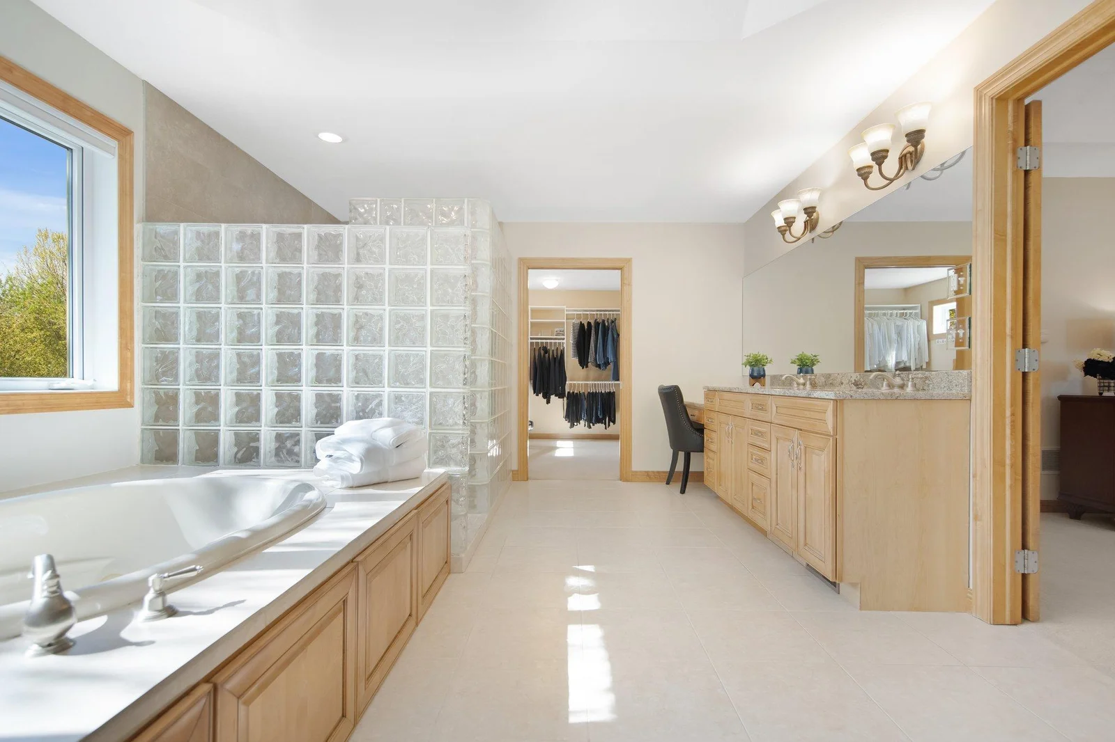 The primary bedroom flows beautifully into this large full bathroom complete with large walk in shower (double shower heads), Soaking Tub, Separate Commode, and a space that could easily be converted to a laundry room for a washer and dryer!