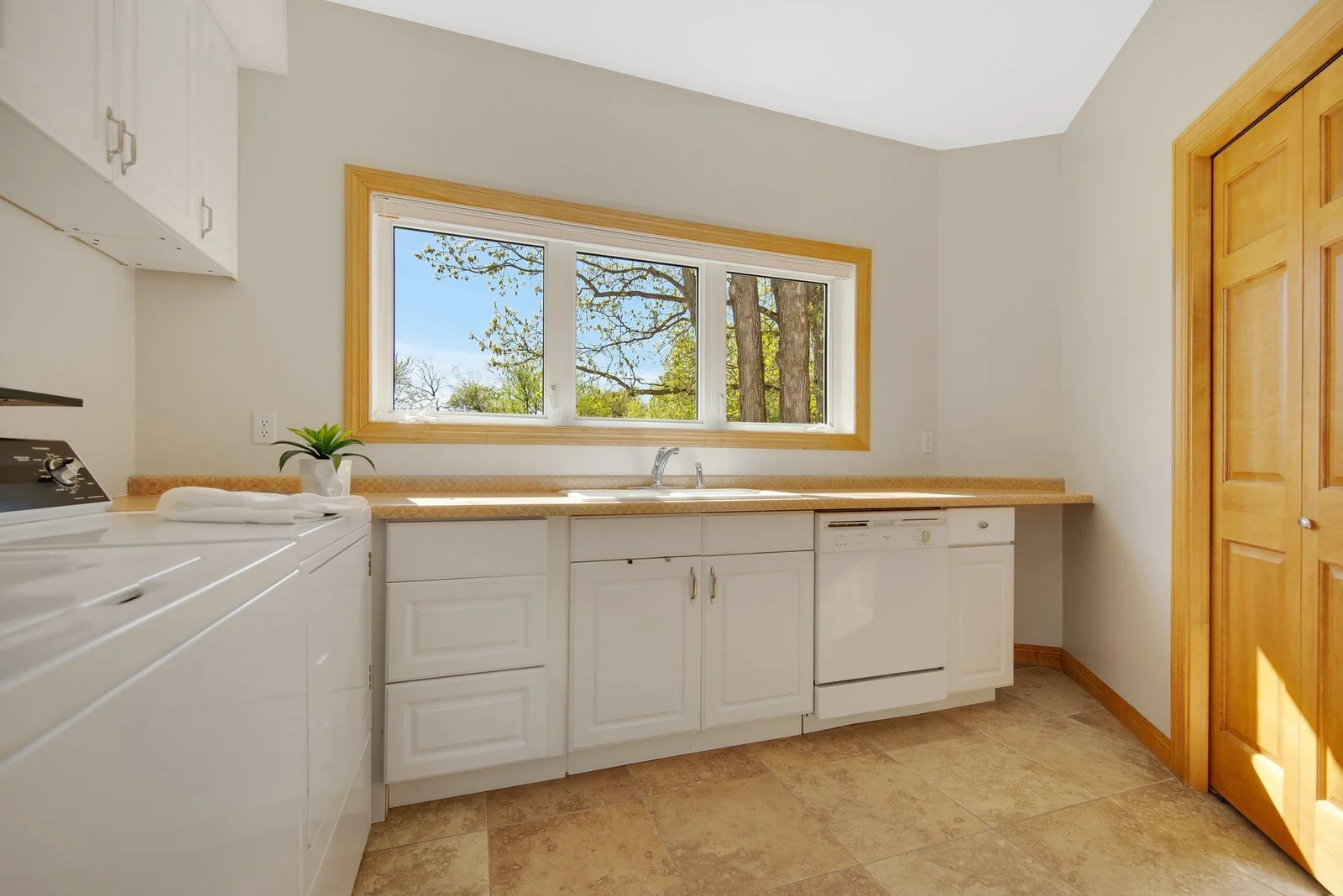 And an oversized main floor laundry room which could be easily converted into a large butlers panty. This space is already equipped with sink and dishwasher!