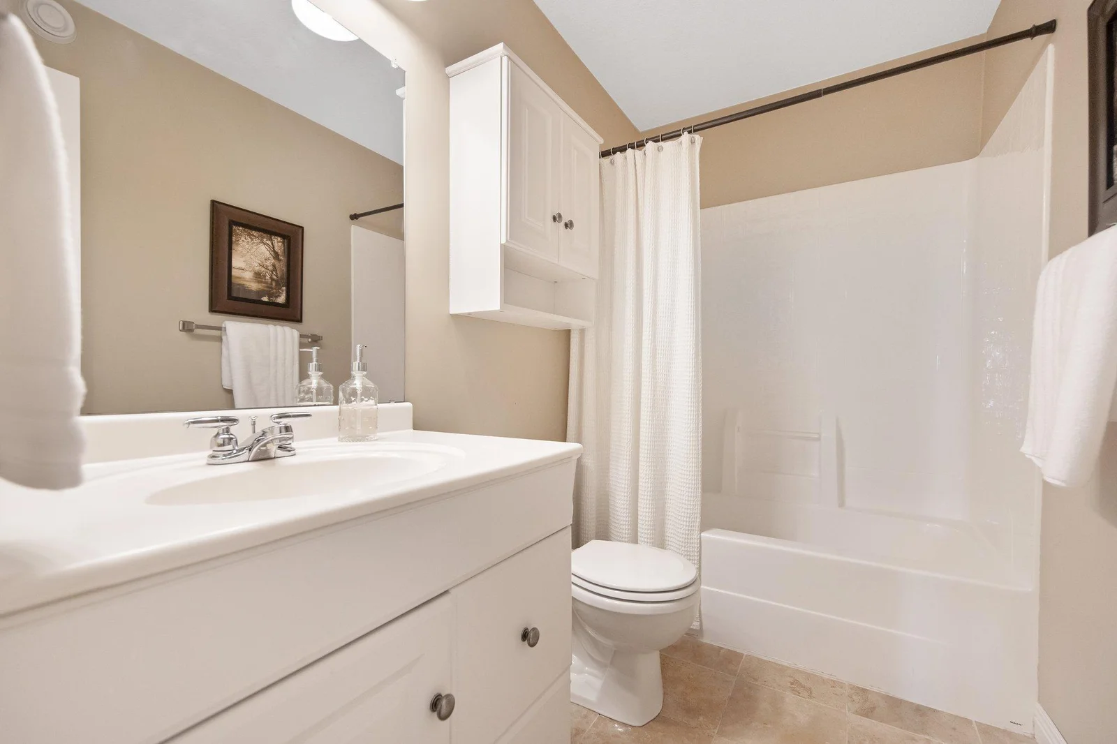 Main floor full bathroom just off of 2nd bedroom.