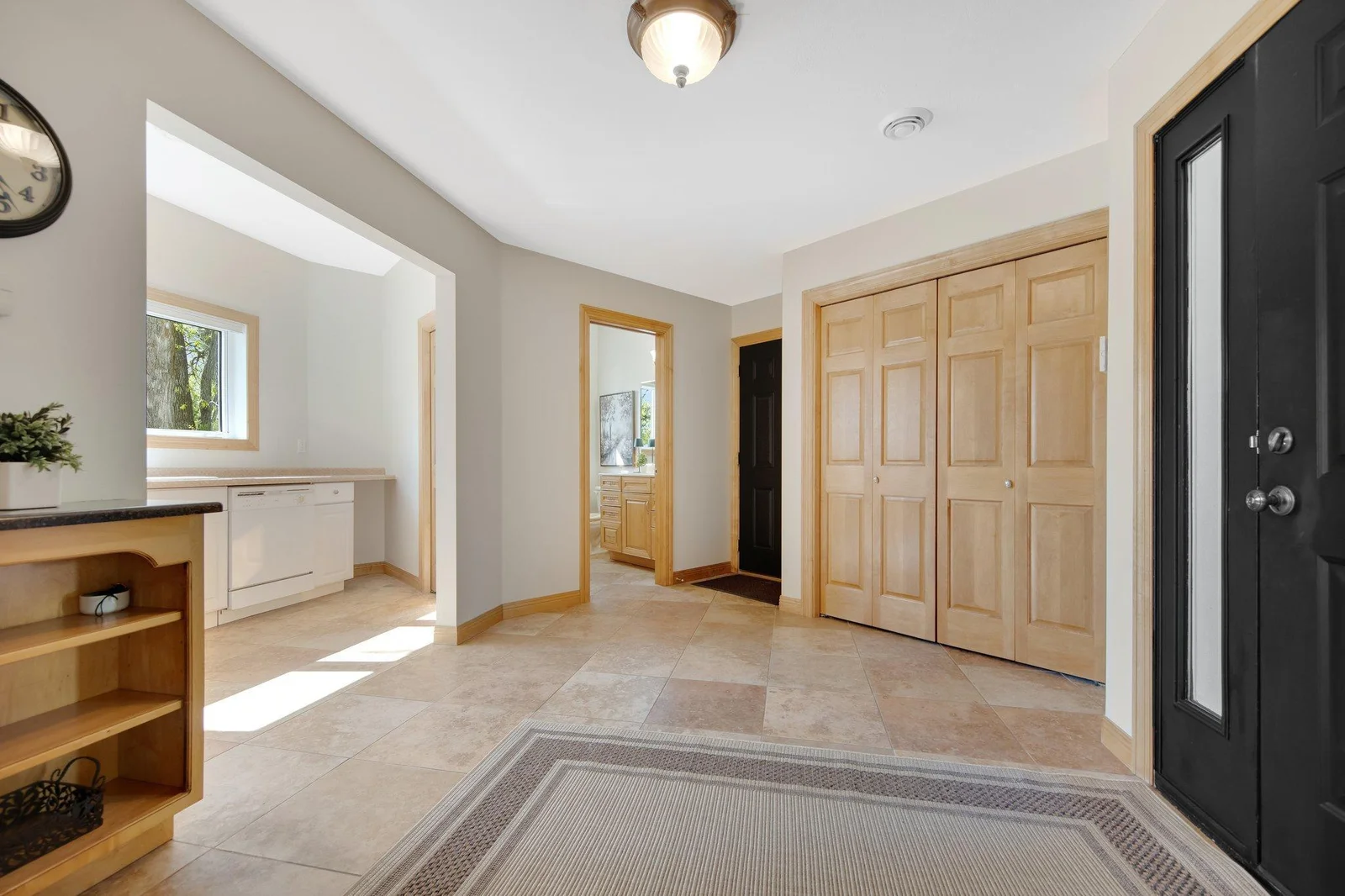 Speaking of Entertaining, a large mud room complete with tile floors awaits your guests giving them space to enter.