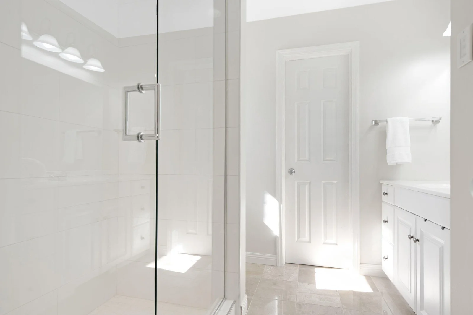 Main floor primary 3/4 bathroom, complete with large walk in closet.