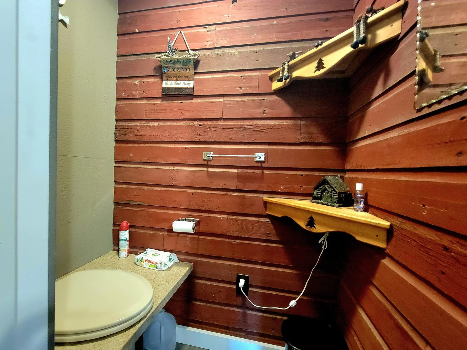 Primitive bathroom in garage upper
