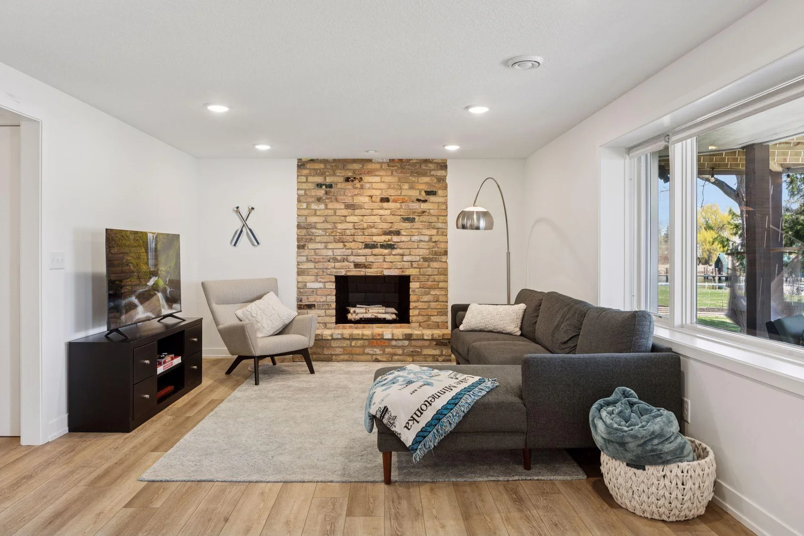 Great lower level hangout spot with wood burning fireplace and lake views