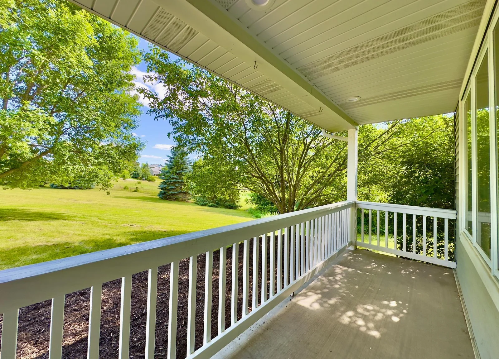 Lovely front porch is a perfect place to pass the summer evenings