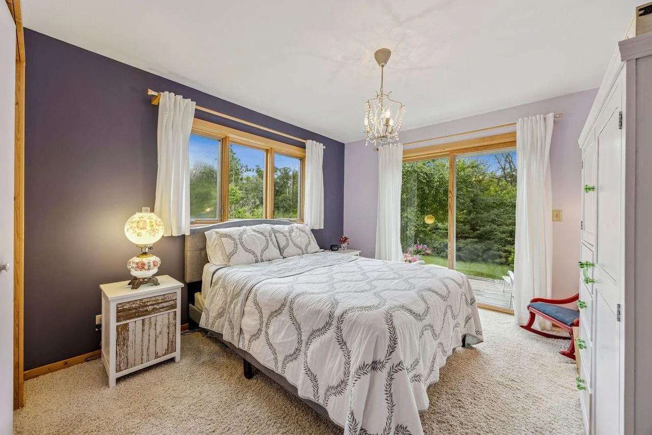 Main floor bedroom with private deck.