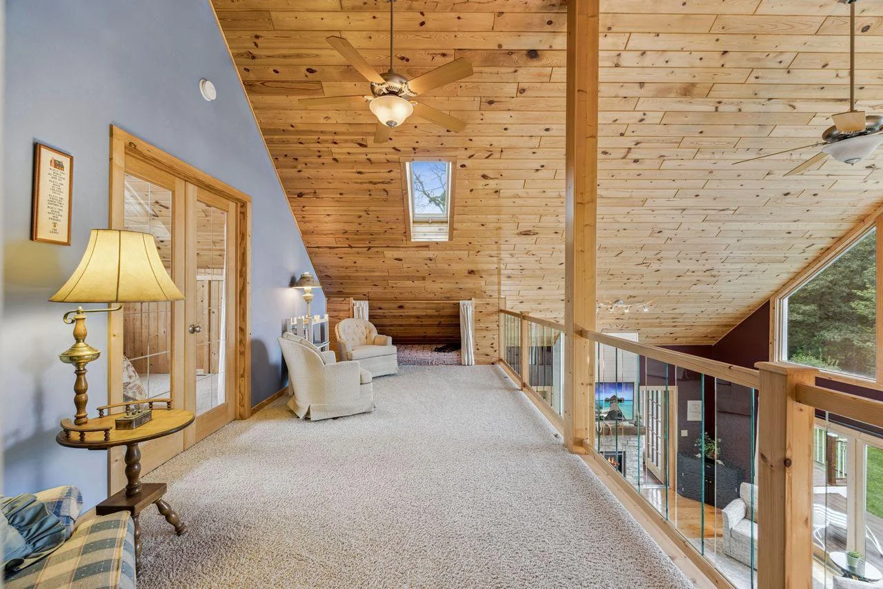 Upper level loft.  French doors lead to the guest bedroom.