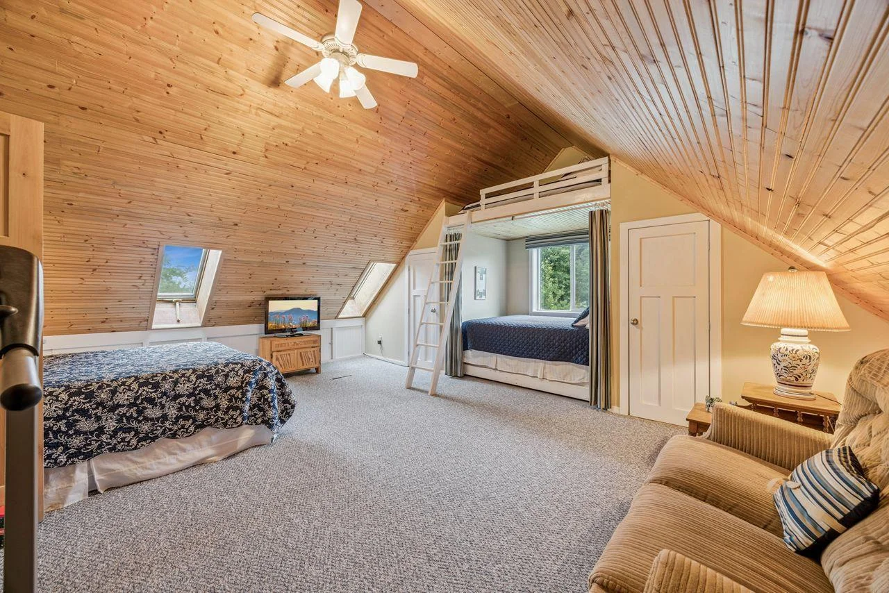 Bonus room above garage is currently used as a bunk room.