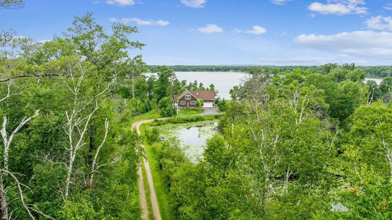 Aerial view from the corner of property at the beginning of driveway.