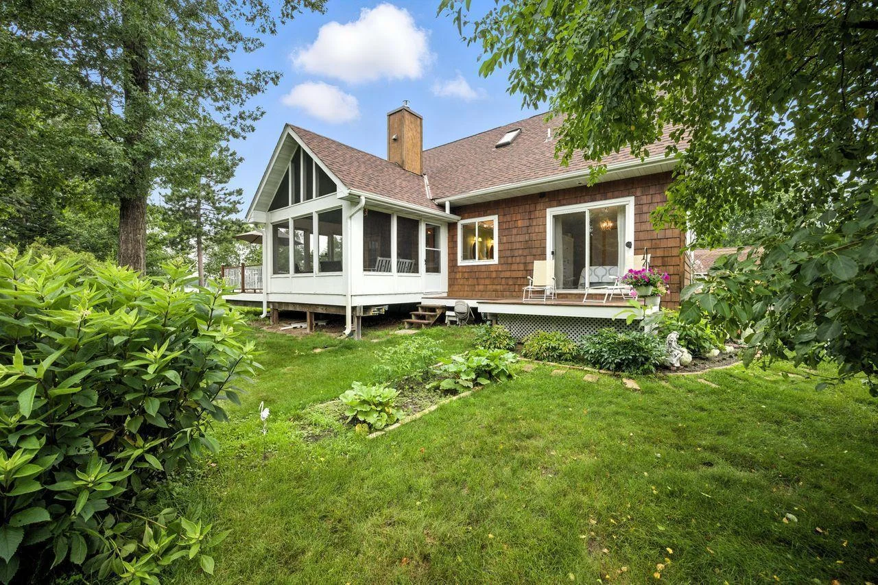 South side of the house with deck off of main floor bedroom.