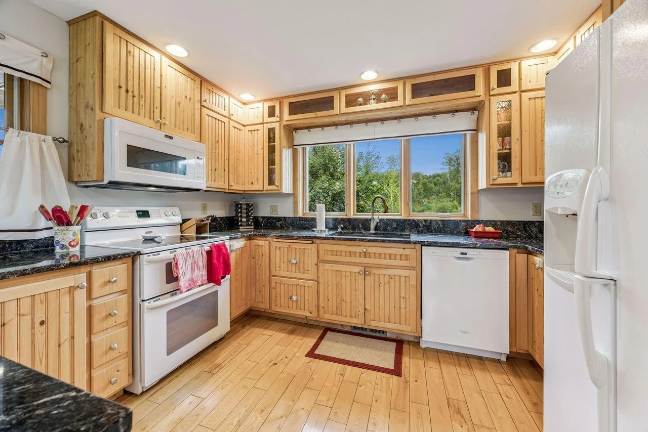 East facing windows in the kitchen overlooking the pond.