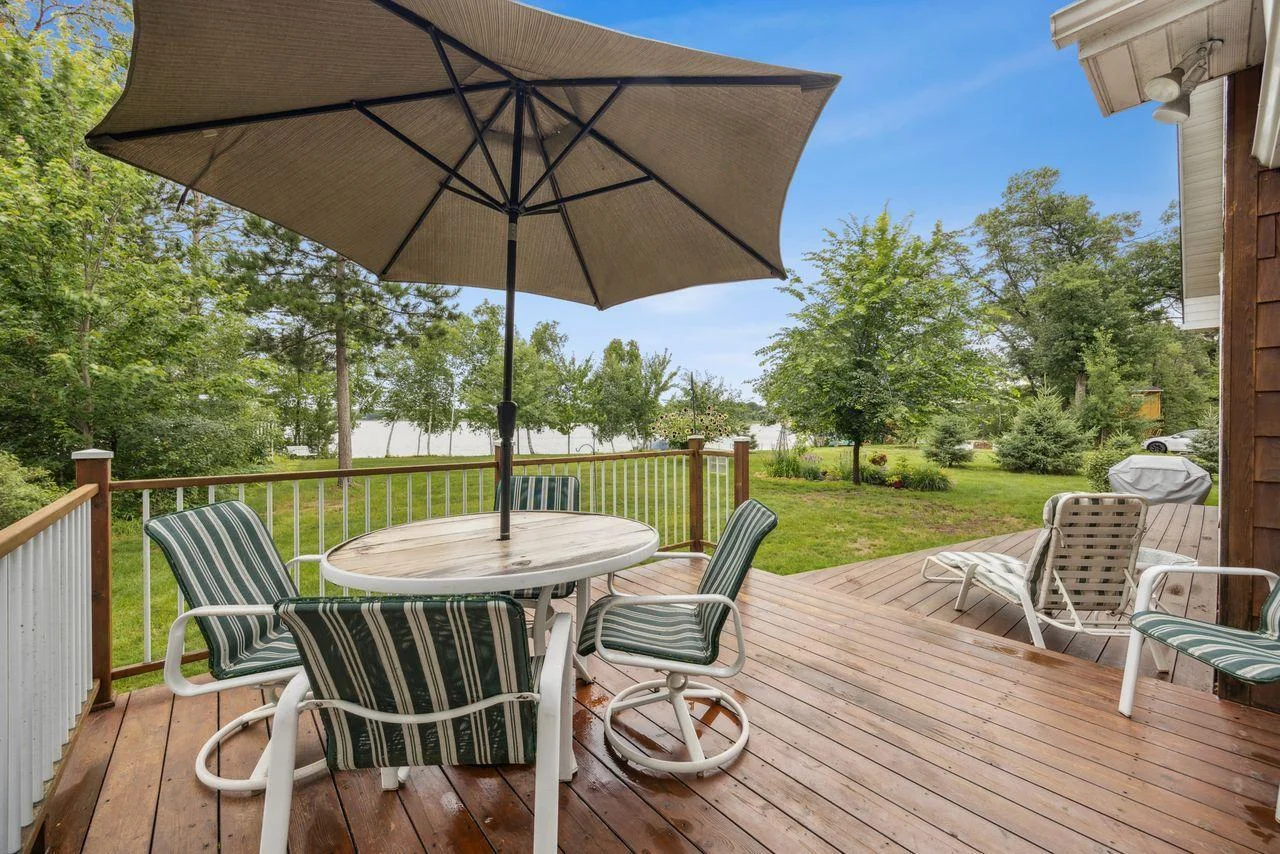 Deck off of screen porch overlooking the lake.