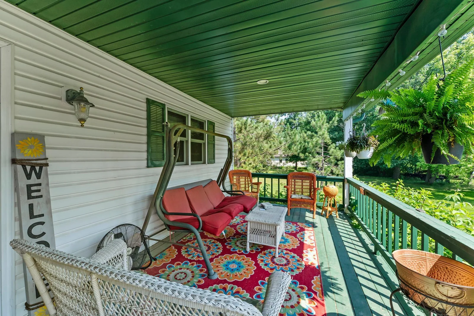 This large front porch was designed for enjoying warm weather and taking in the view of the lake.