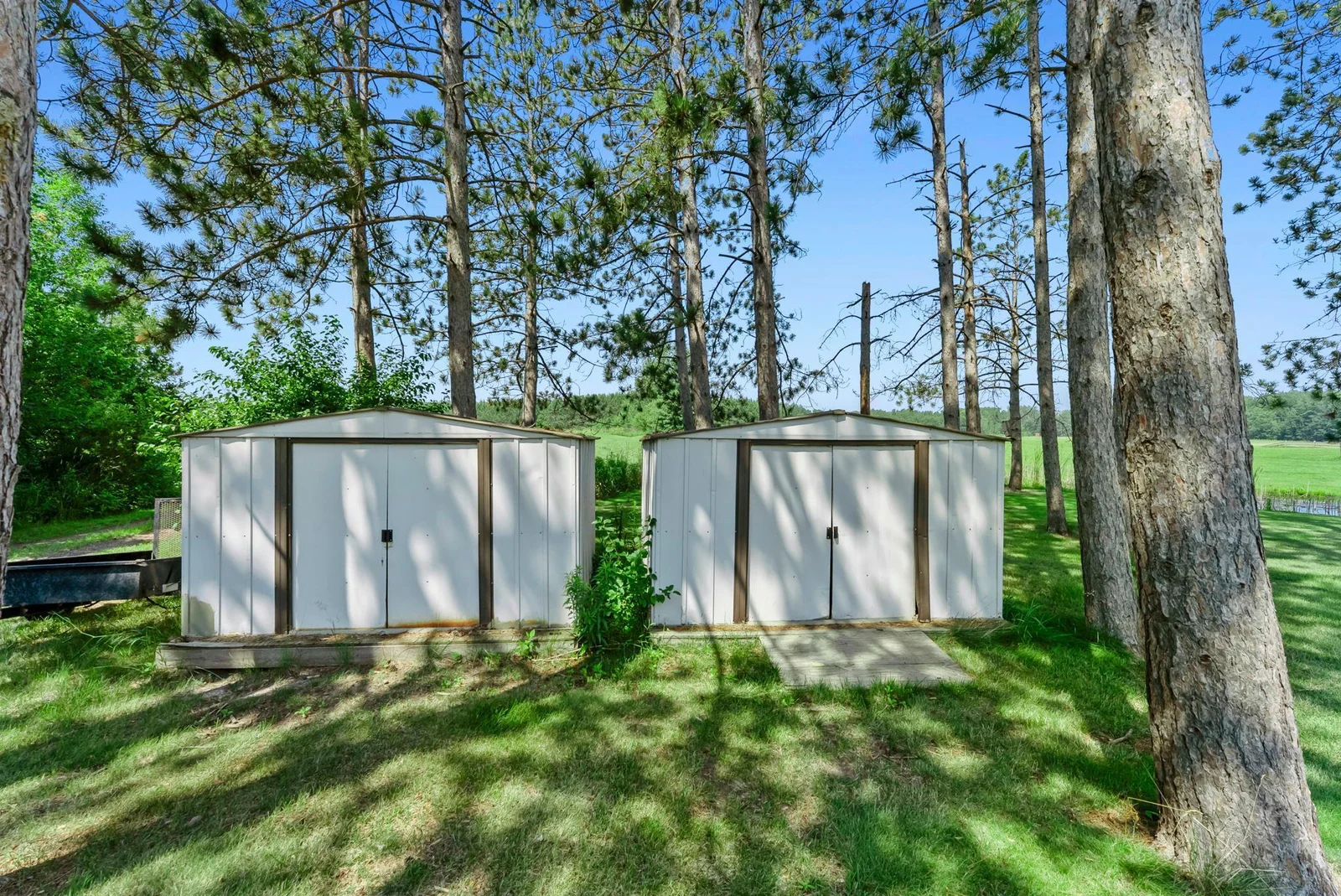 Two sheds hold everything that won't fit in the three-car garage.