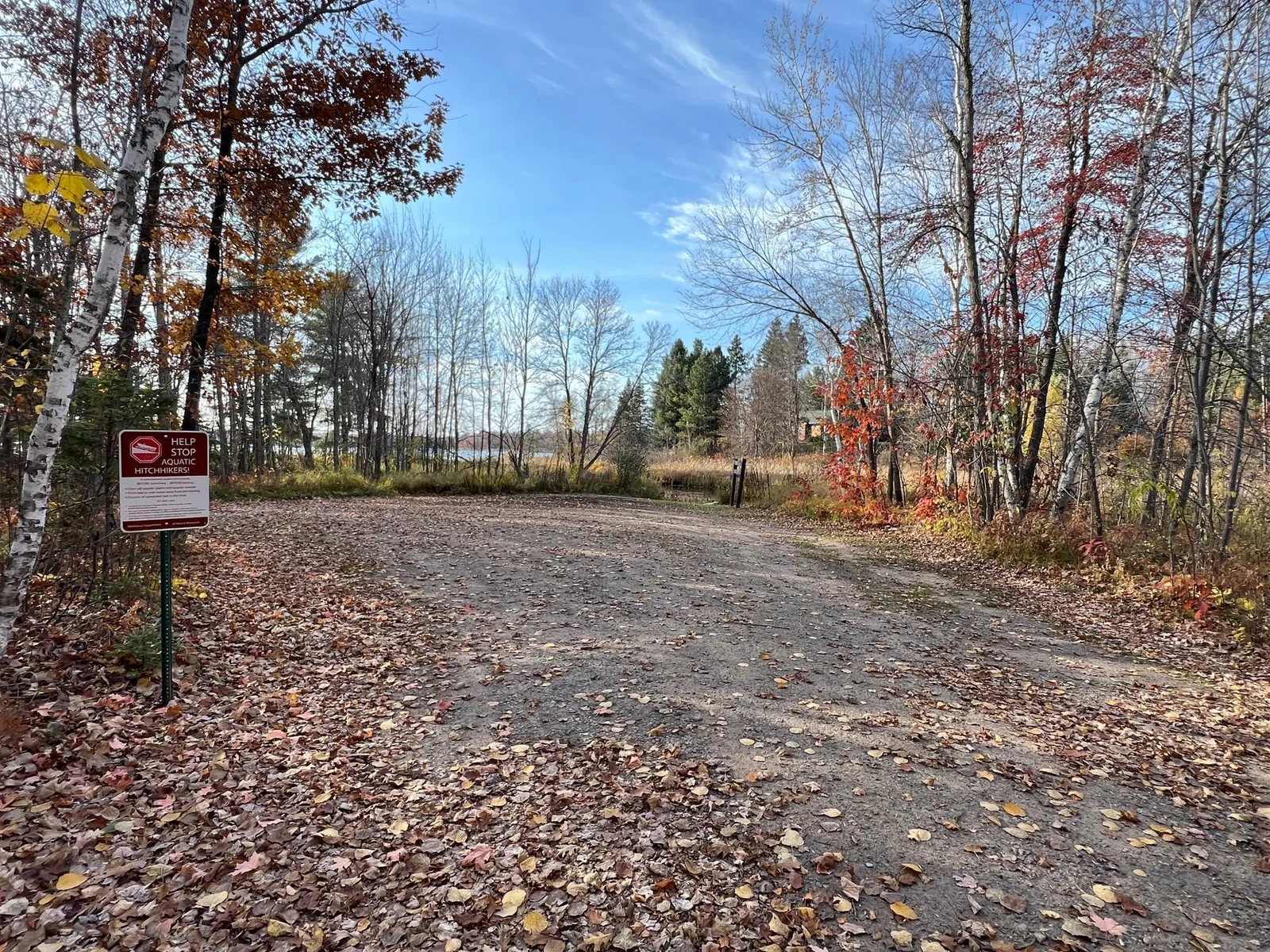 THE PUBLIC LAKE ACCESS PARKING AREA.
