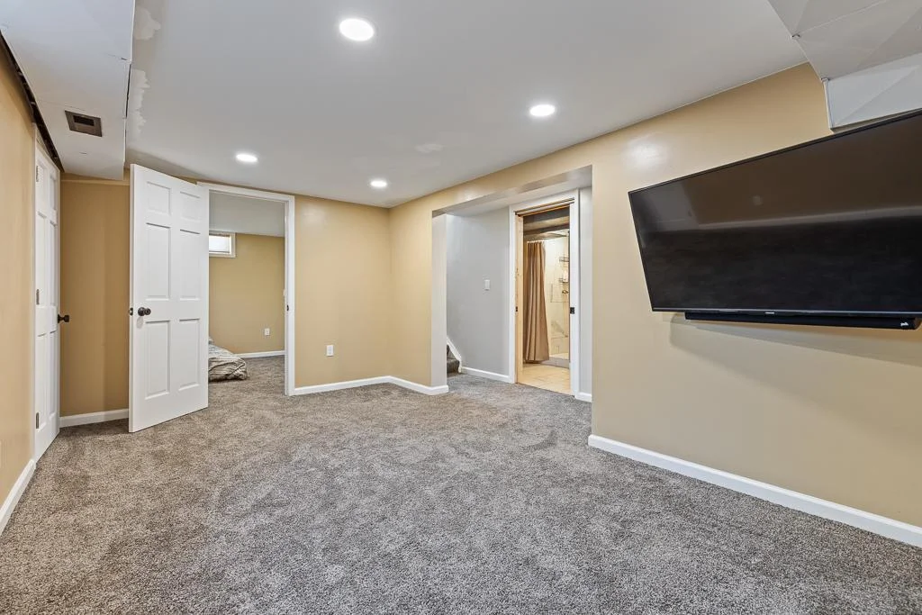 The family room is perfect for a movie night, or just offering a secluded space when you have an abundance of company