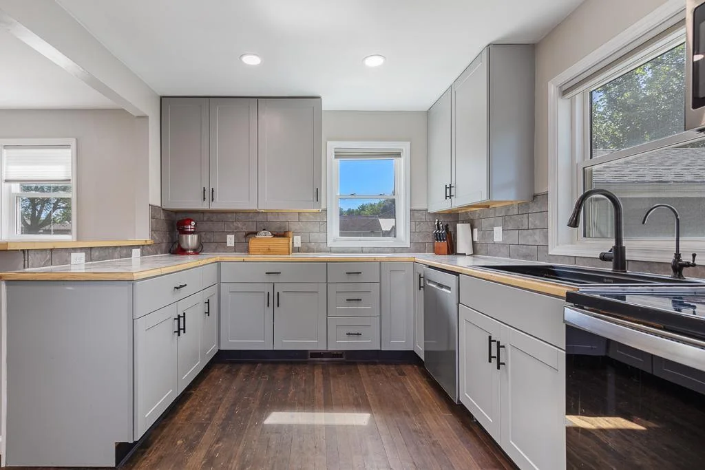 The dark hardwood floors throughout the entire main floor are simply stunning