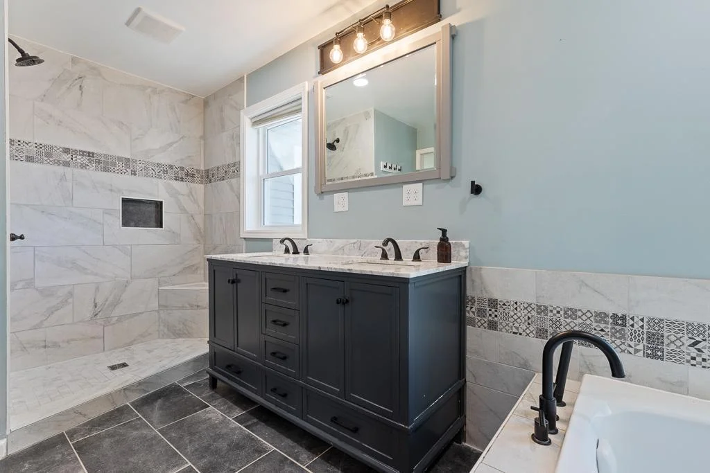 Gorgeous tile work surrounds the entire bathroom!