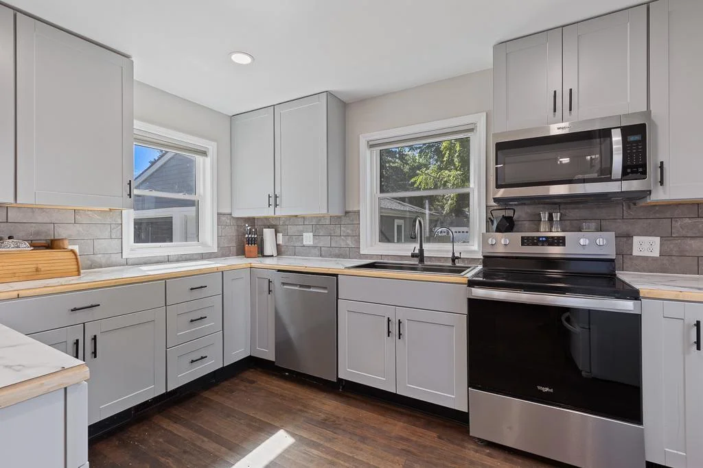 The kitchen is absolutely charming as it is functional. Every detail has been carefully chosen from the tile backsplash to the finishes and appliances.