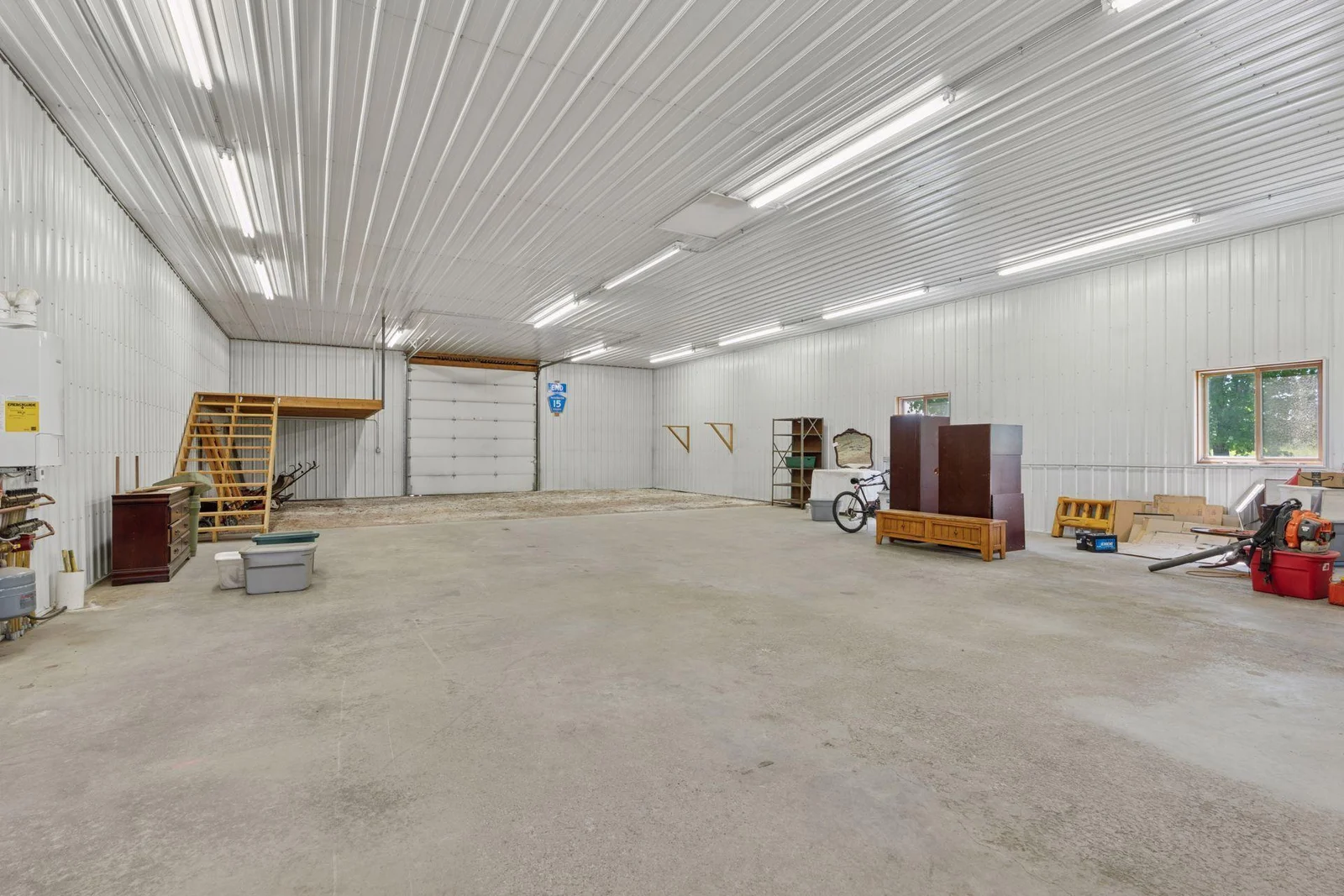 80' by 40' pole building is insulated heated (Wirsbo in-floor heat) and has concrete floor, loft, and 3 doors for easy access.