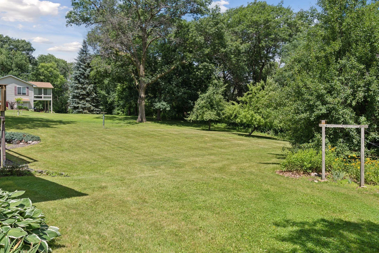 Large yard with ample mature trees.