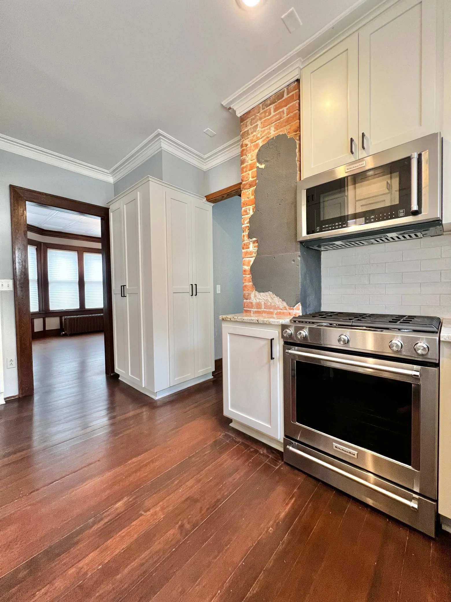 Custom Cabinets with Soft Close Feature, Kitchen Aid Pro Series Appliances, Ceramic Tile Backsplash, Granite Counter Tops.