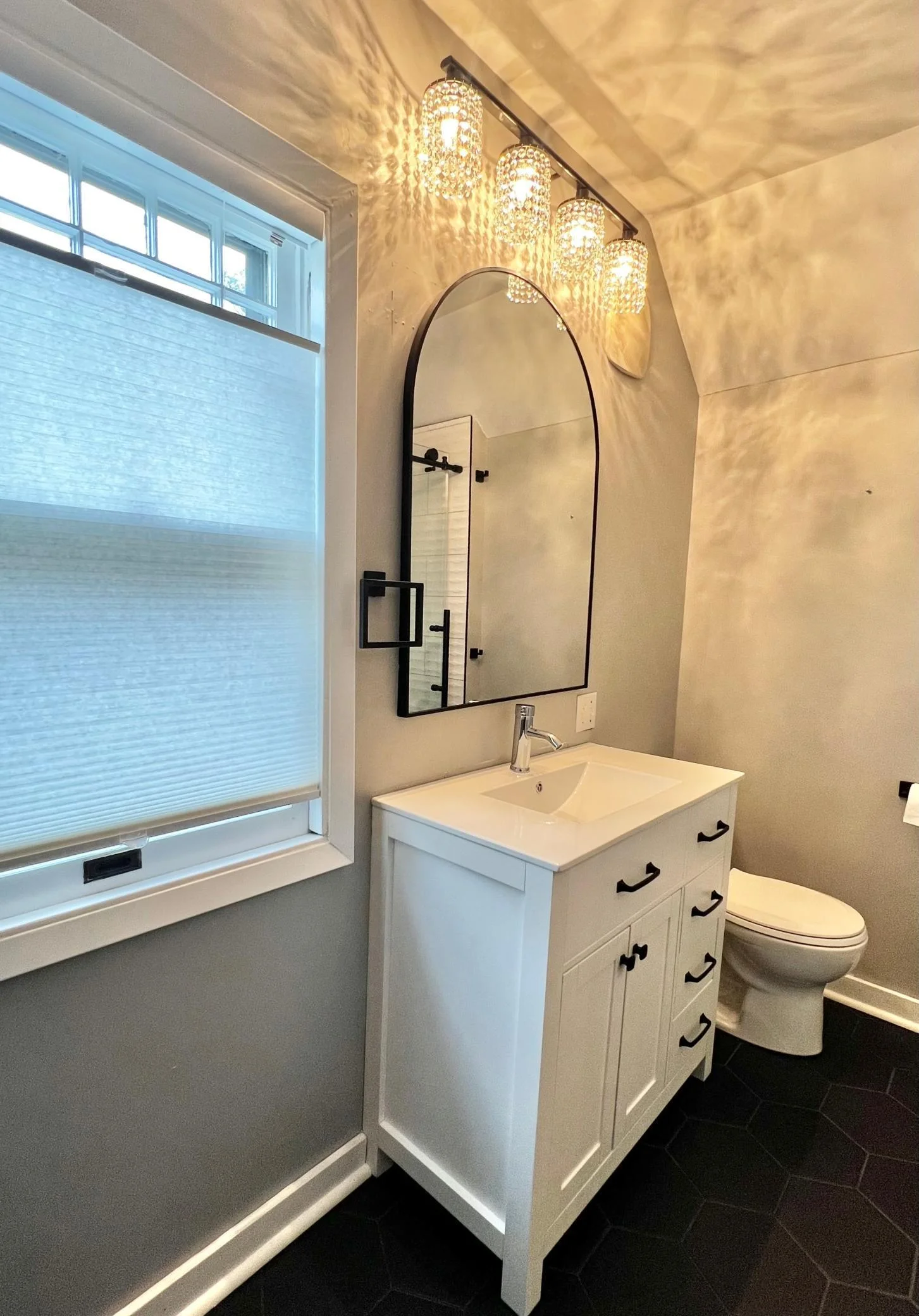 Second Floor Bathroom with Ceramic Tile Floor, New Vanity with Solid Surface Countertop, New Mirror and Fixtures.