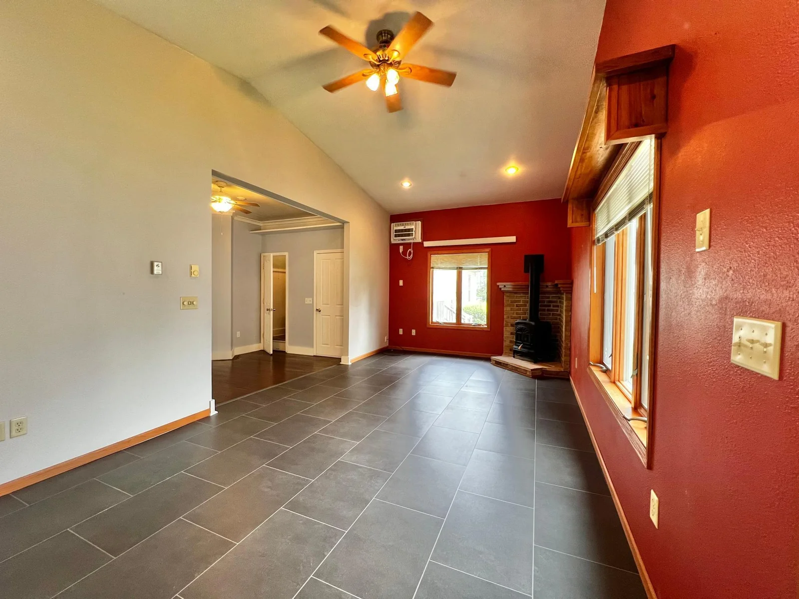 Family Room, with Wall Air Conditioner, Gas Fireplace and New LVP Flooring.