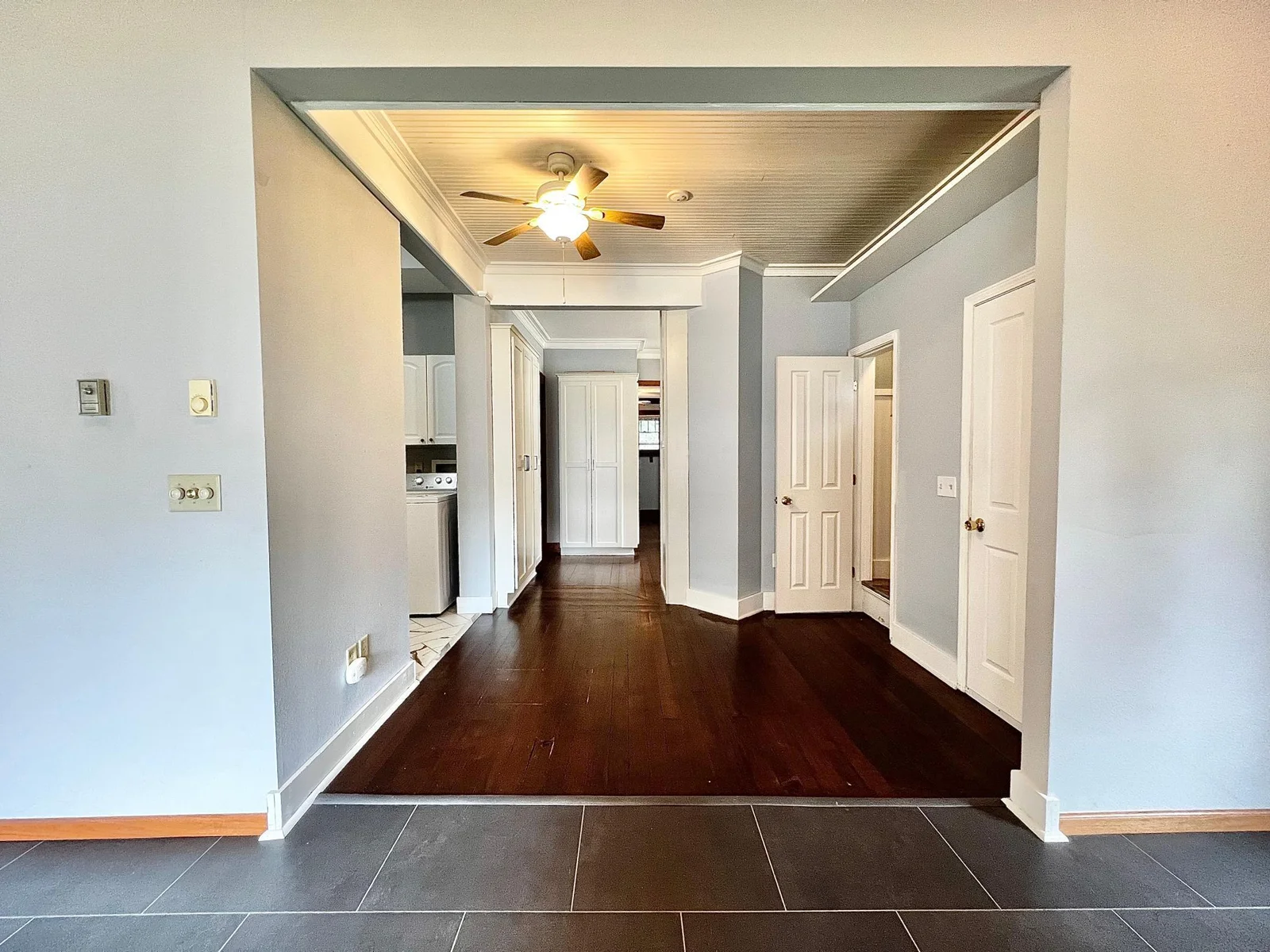 View from Family Room to Basement Door, 1/2 Bath, Laundry Room/Main Floor Full Bath and Kitchen.