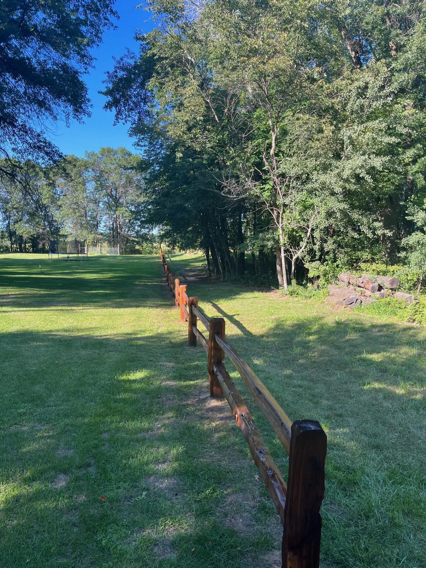 Split rail fencing is close to the property line
