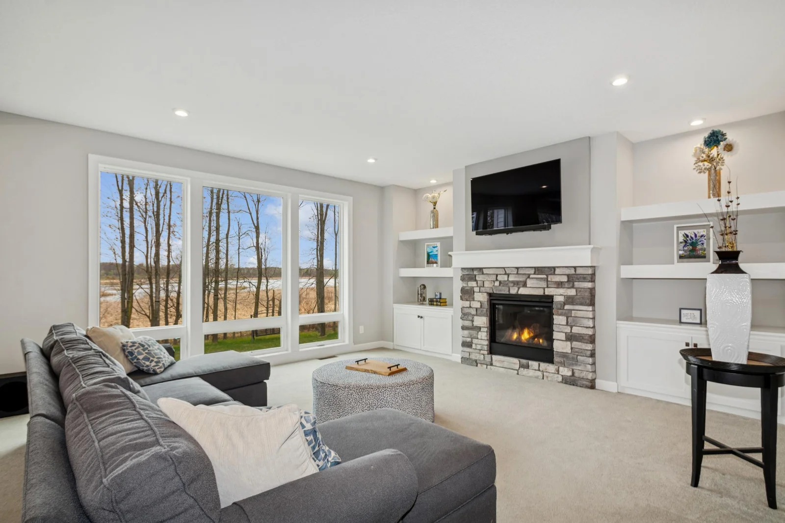 Spacious Living Room--Custom built ins & fireplace