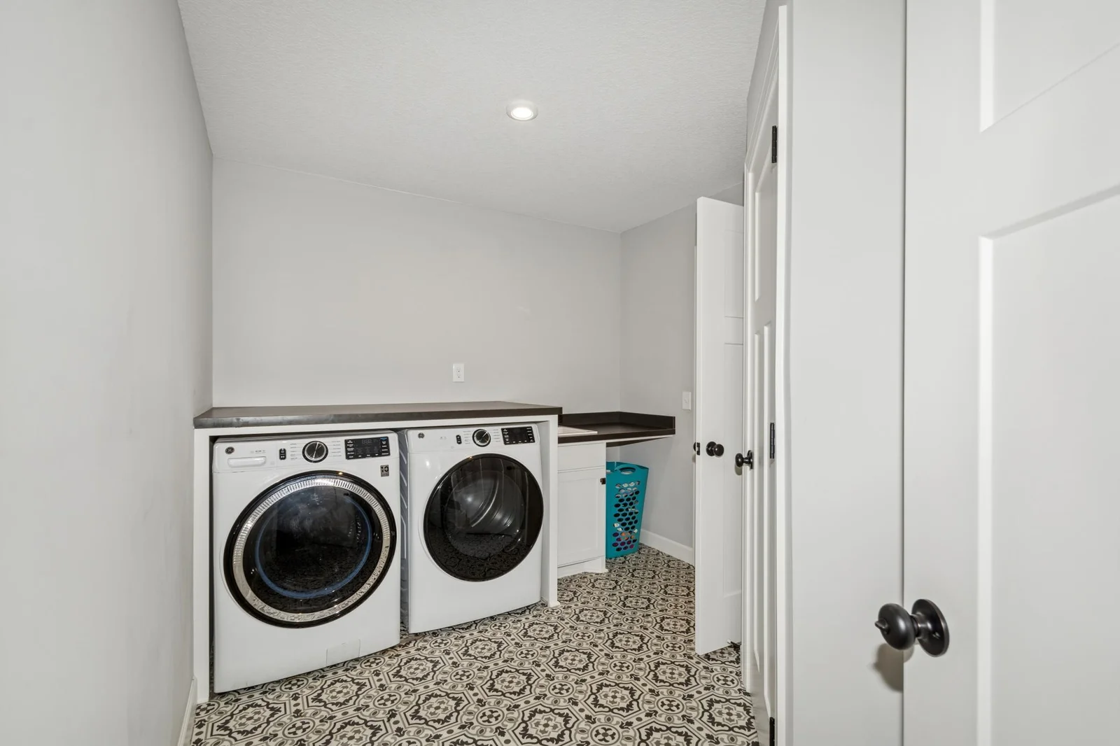 Walk thru the laundry room to the upper-level hall and the owner's suite