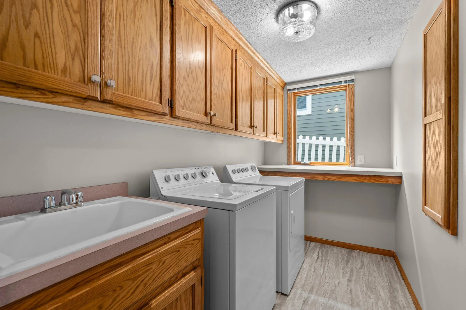 Lower level laundry room with sink
