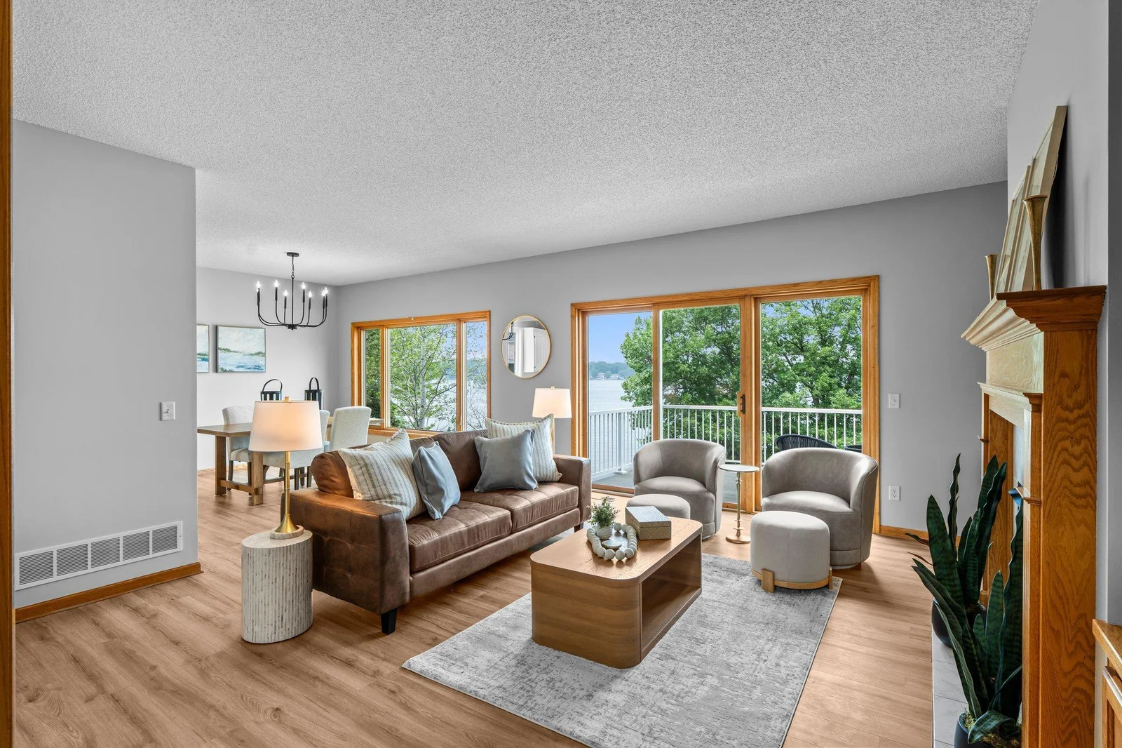 A full length lake view awaits in the main level living & dining room