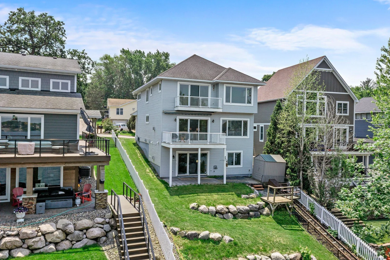 Back of the home filled with windows from each level for stunning views!